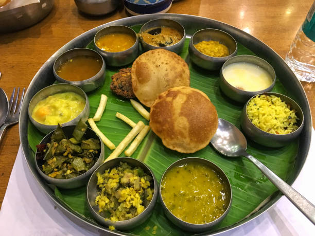 A special south India veg thali served on banana leaf in a hotel in Pune, India.